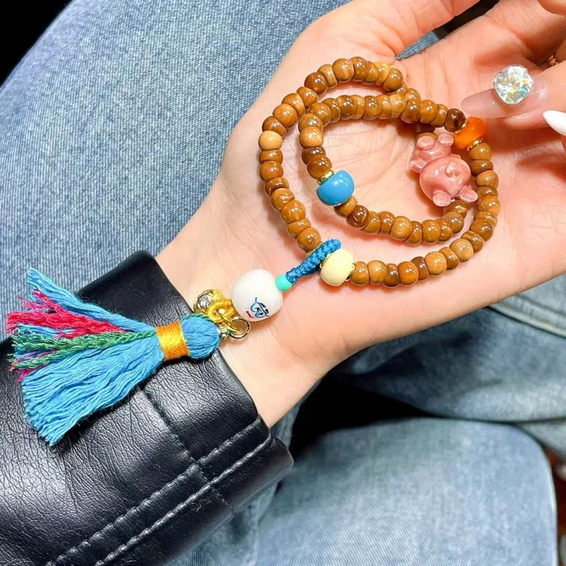 

Cook Large Intestine Double Circle With Sandalwood Violent Bear Bone Sieve Bracelet