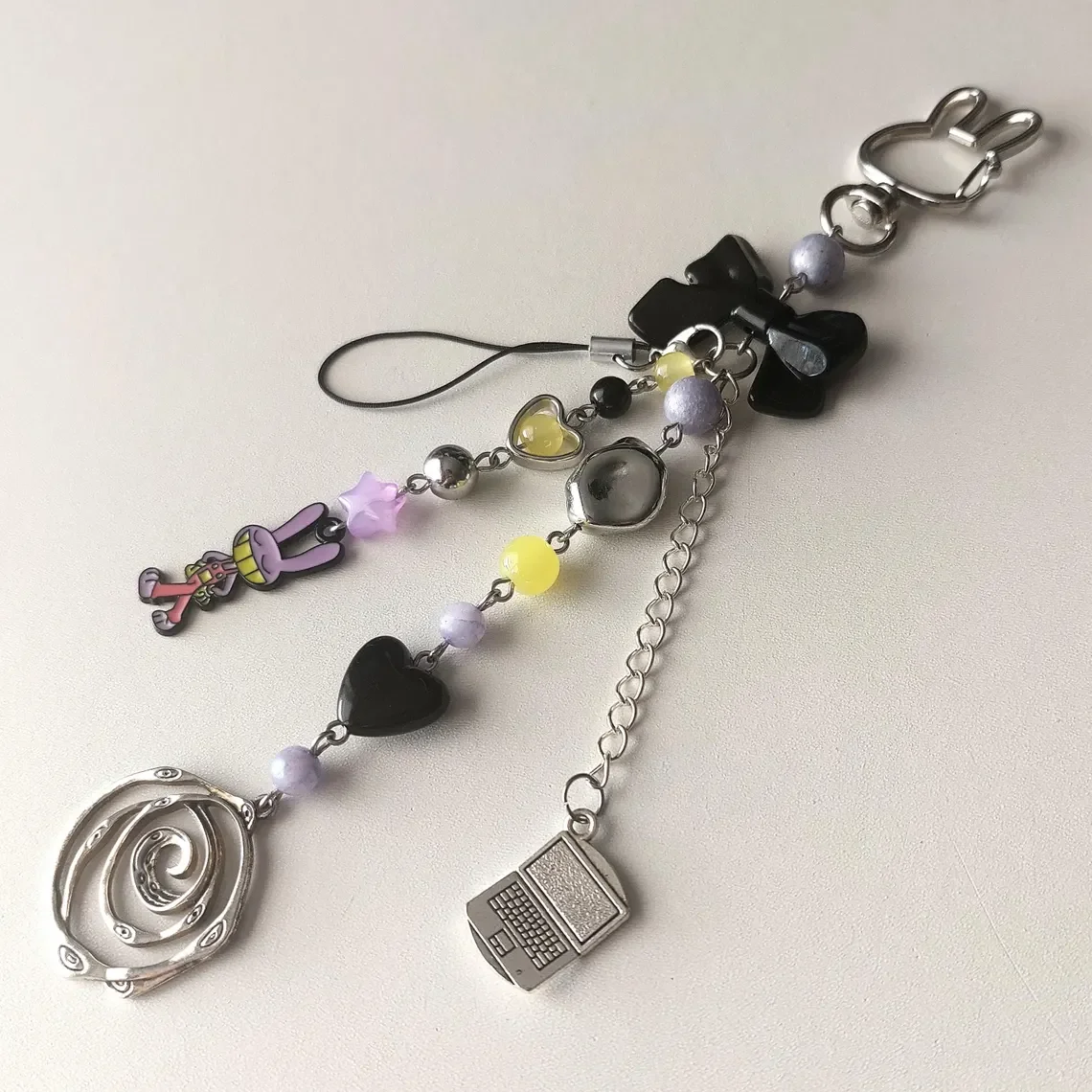 السيرك الرقمي المذهل، سلسلة مفاتيح جاكس، سلسلة مفاتيح بومني TADC، سحر الحقيبة