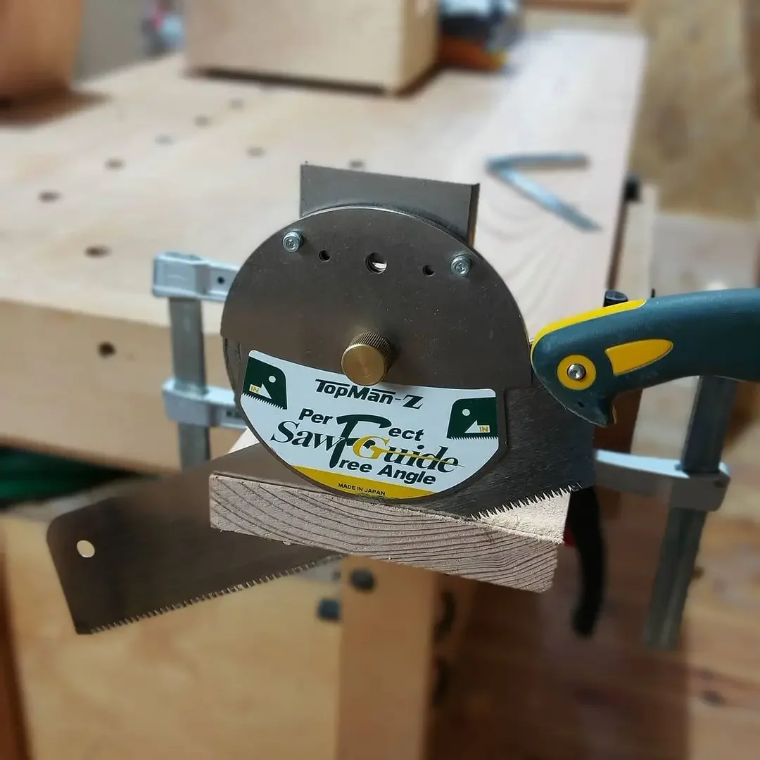 

hand saw, woodworking board, hardwood mahogany board horizontal and vertical miter cut material