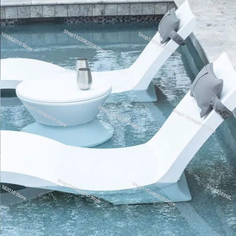 White fiberglass ergonomic oversized beach loungers swimming pool wet deck ledges water sun loungers outdoor