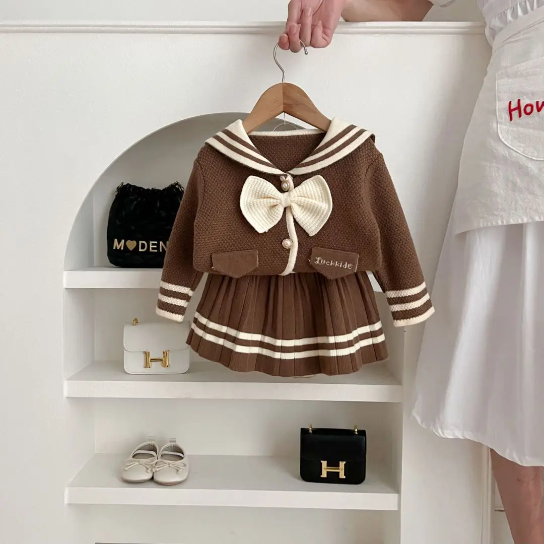 جديد ملابس الأطفال دعوى طفل الفتيات نمط Preppy سترة + التنانير 2 قطعة مجموعات الاطفال القوس الحياكة البلوفرات الفتيات البلوز معطف