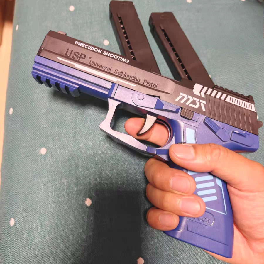 Pistola USP de disparo continuo con carcasa de lanzamiento láser, pistola de juguete colgante vacía, lanzador de juegos al aire libre, regalo de Navidad