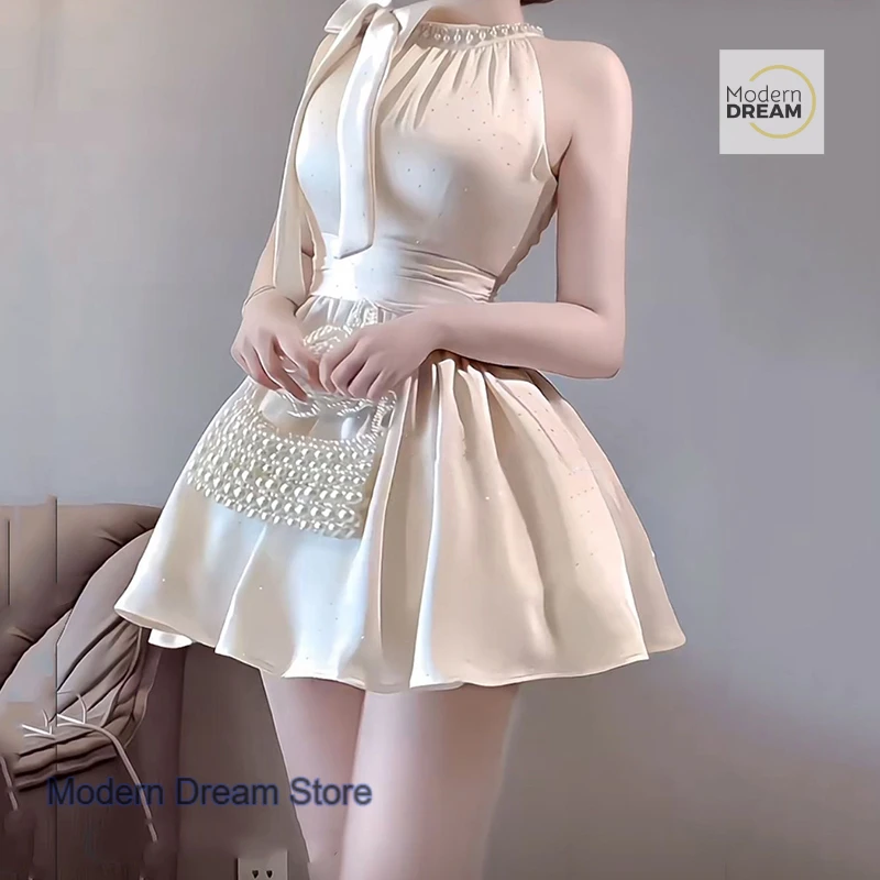

French sweet rhinestone bright flashing bow hanging neck sleeveless dress women's summer new temperament slim A-line skirt.