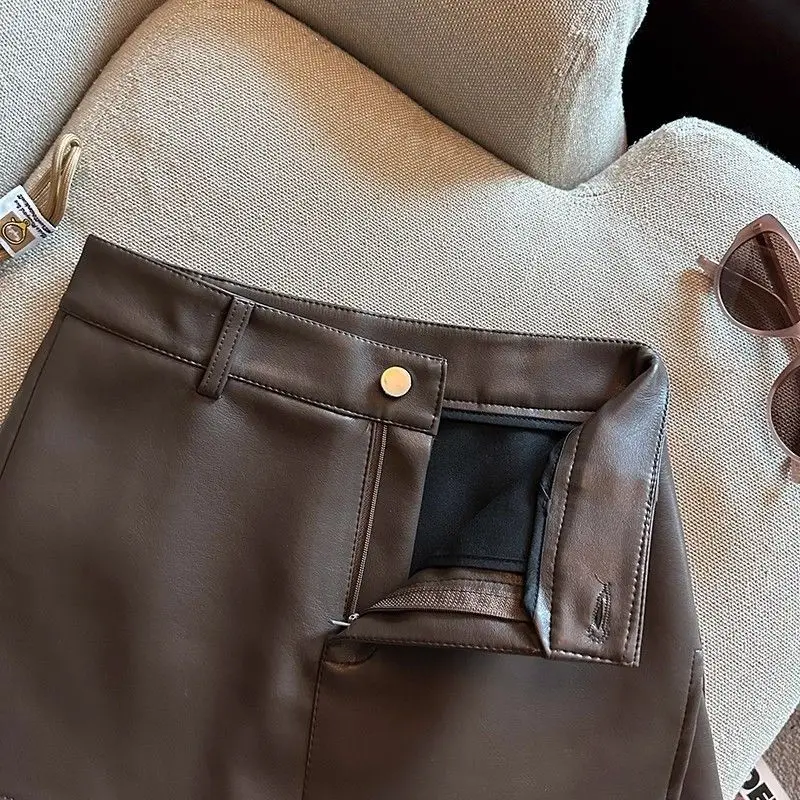 กระโปรงหนัง PU วินเทจทรงเอ สั้น เอวสูง แฟชั่นผู้หญิง สำหรับฤดูใบไม้ร่วงและฤดูหนาว ทรงเข้ารูป สไตล์สตรีทแวร์ รุ่นใหม่