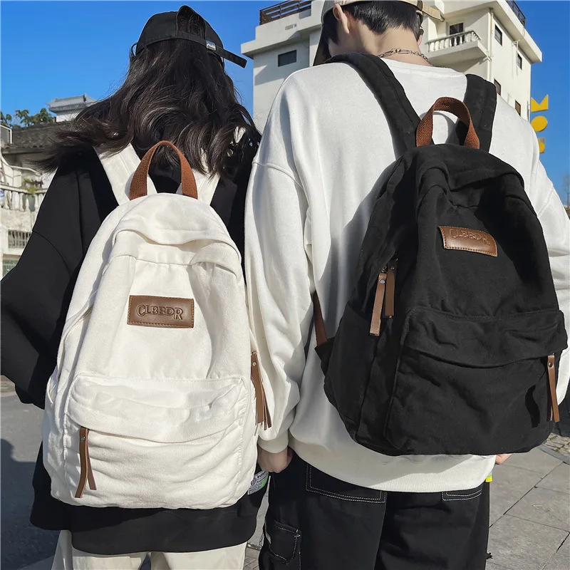 

Leisure simple canvas bag male and female college students high school students simple backpack retro travel backpack