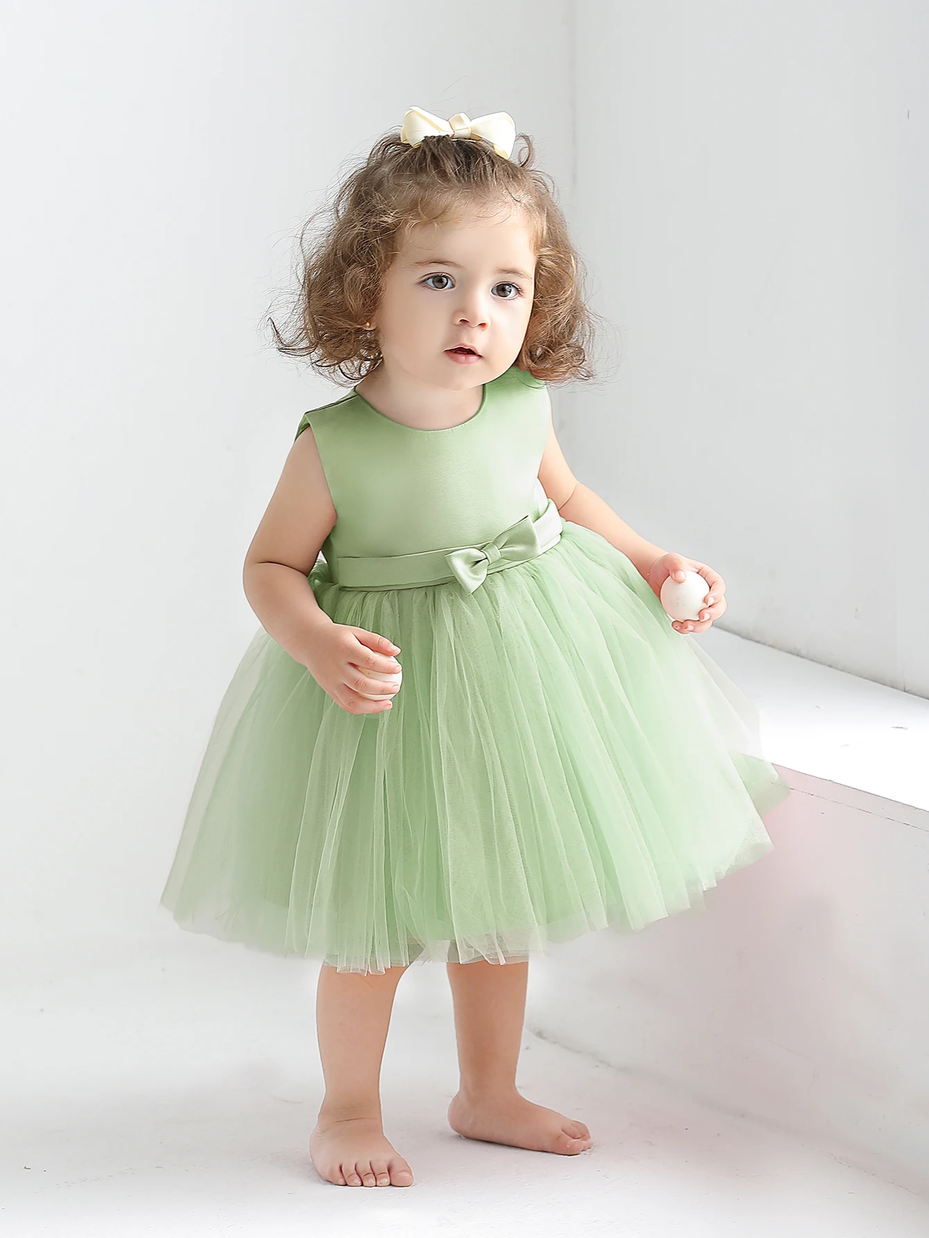 Baby Girl Dress Made of Soft Green Satin Fabric with Blend of Net Fabric. Suitable for Parties, Birthday Celebrations,Vacations.