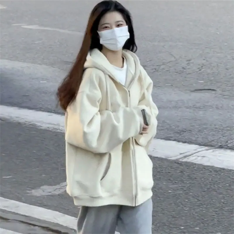 A Light Pink Solid Hooded Sweatshirt for Women in A Loose and Laid-back Style A Thin Zippered Cardigan Top for Spring and Autumn