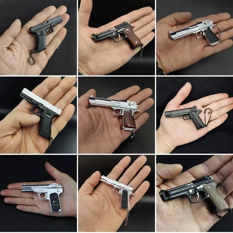 G34 G17 M1911 92F M4A1 M16 AK47 Wysokiej jakości metalowy pistolet zabawkowy Miniaturowy model 1:3 92F Brelok do kluczy Prezenty urodzinowe