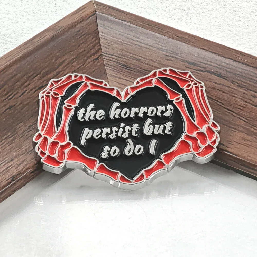 The Horrors Persist But So Do I Enamel Pin Skeleton Hands Heart Brooch Gothic Skull Metal Badge Funny Quote Jewelry Bag Gift