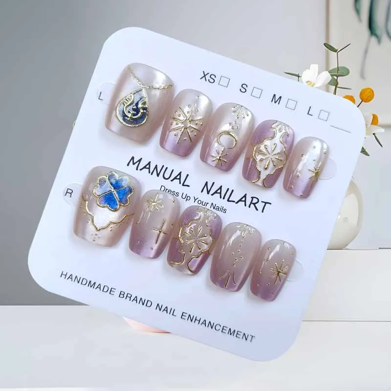 เล็บปลอมกดติดลายแมวตาสี่แฉกน่ารัก 10 ชิ้น สีขาวประดับทอง สวยหรู ระดับไฮเอนด์ สำหรับตกแต่งเล็บ