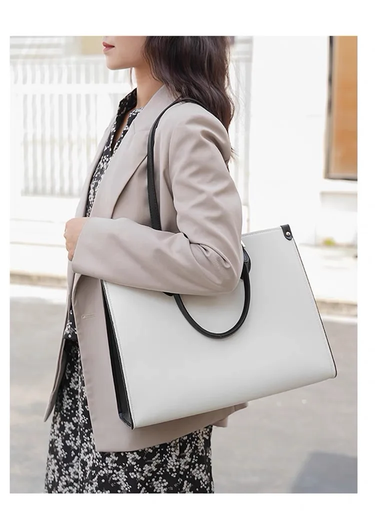 New women's handbag, men's briefcase, double-sided black and white waterproof computer bag, fashionable and multifunctional