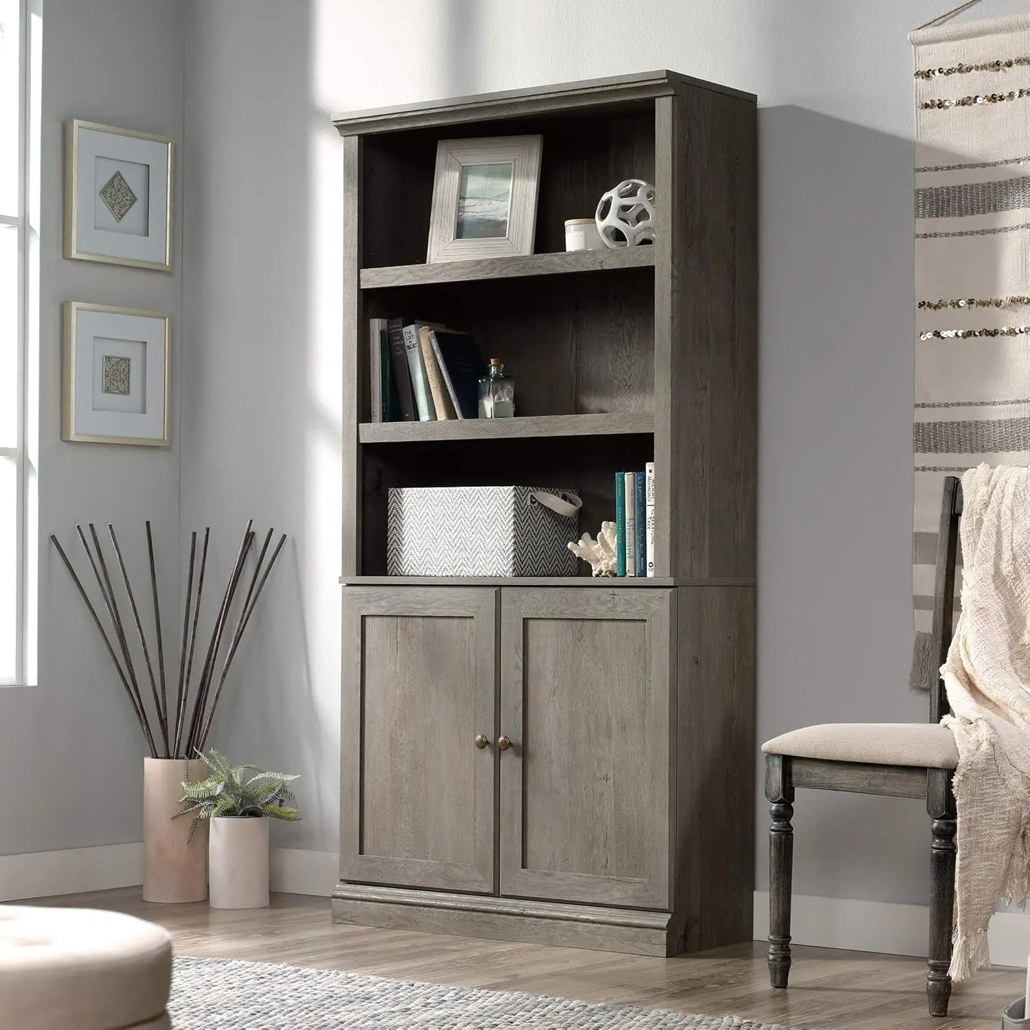 Three adjustable bookshelves, flexible storage options behind hidden storage doors help hide clutter