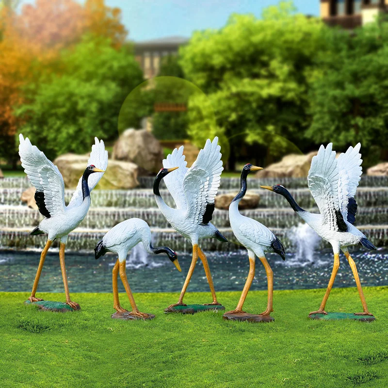 Outdoor simulation of red-crowned cranes, cranes, and fiberglass decorations. Animal sculpture park landscape, courtyard