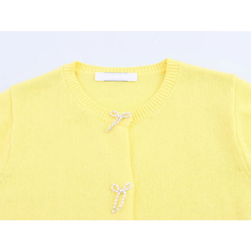 YENKYE 2025 Women Faux Pearl Bow Knit Cardigan Short Sleeve Round Neck Elegant Casual Yellow Top