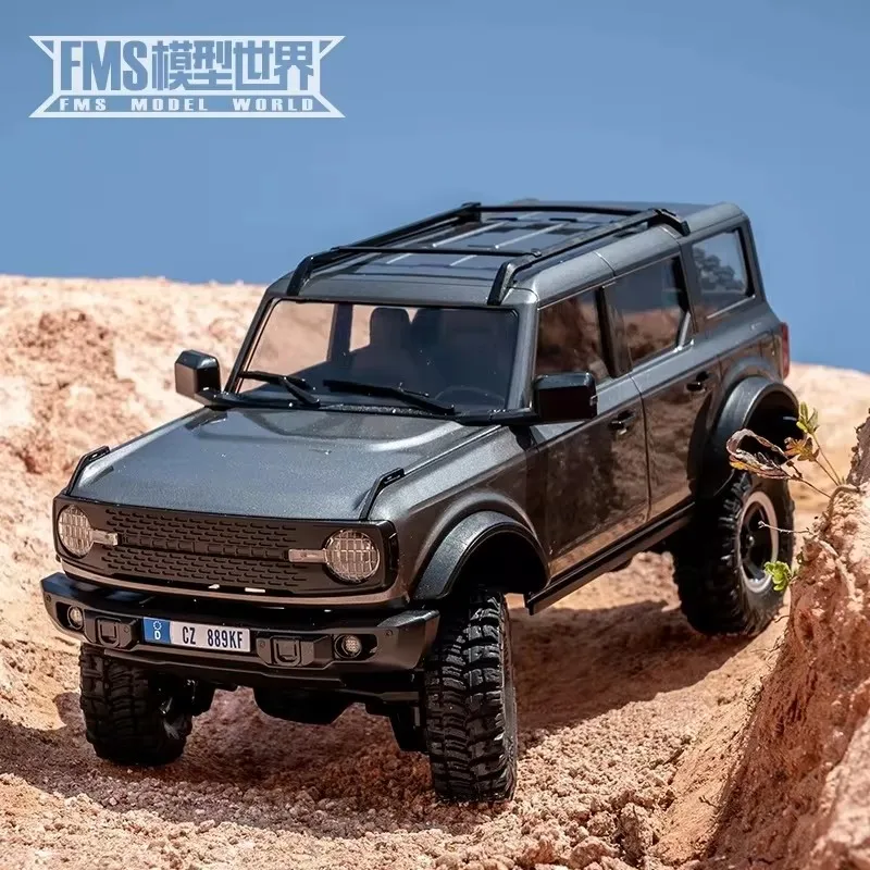 ของเล่นโมเดลจำลองเปลือกแข็งรถสำหรับปีนเขาทางวิบากแบบ FMS 1/18 Bronx Gold Rush Ford Wrangler mobil REMOTE CONTROL