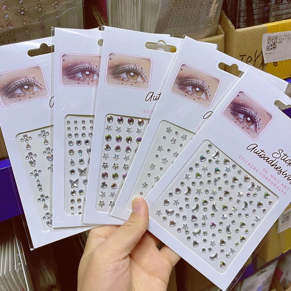 

2 листа наклеек-страз для лица: звезды, луны, сердца, глаза. Блестящие круглые бусины, самоклеящиеся стразы, бриллианты для макияжа, тату-декор для лица.