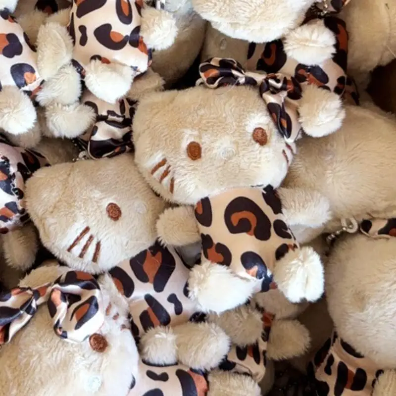2025 nouveau Hello Kitty imprimé léopard en peluche porte-clés Sanrio créatif arc en peluche poupée fille sac à dos pendentif fermeture éclair accessoires jouets