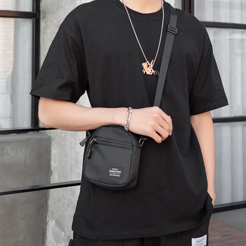 Small Men's Black Nylon Mini Crossbody Shoulder Bag with Front Pocket and Logo Patch Casual Sling Pouch for Daily Travel Work