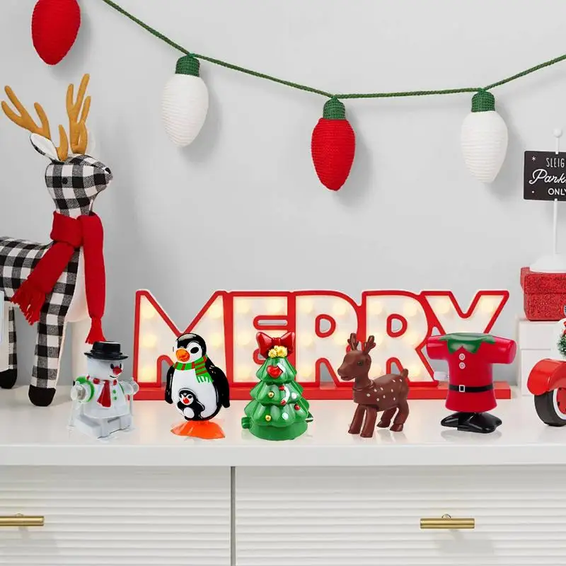 Juguetes de cuerda 8X juguete de salto de Navidad de cuerda juguetes pequeños de Navidad favores de fiesta juguete de relojería de mano surtido para clases niños