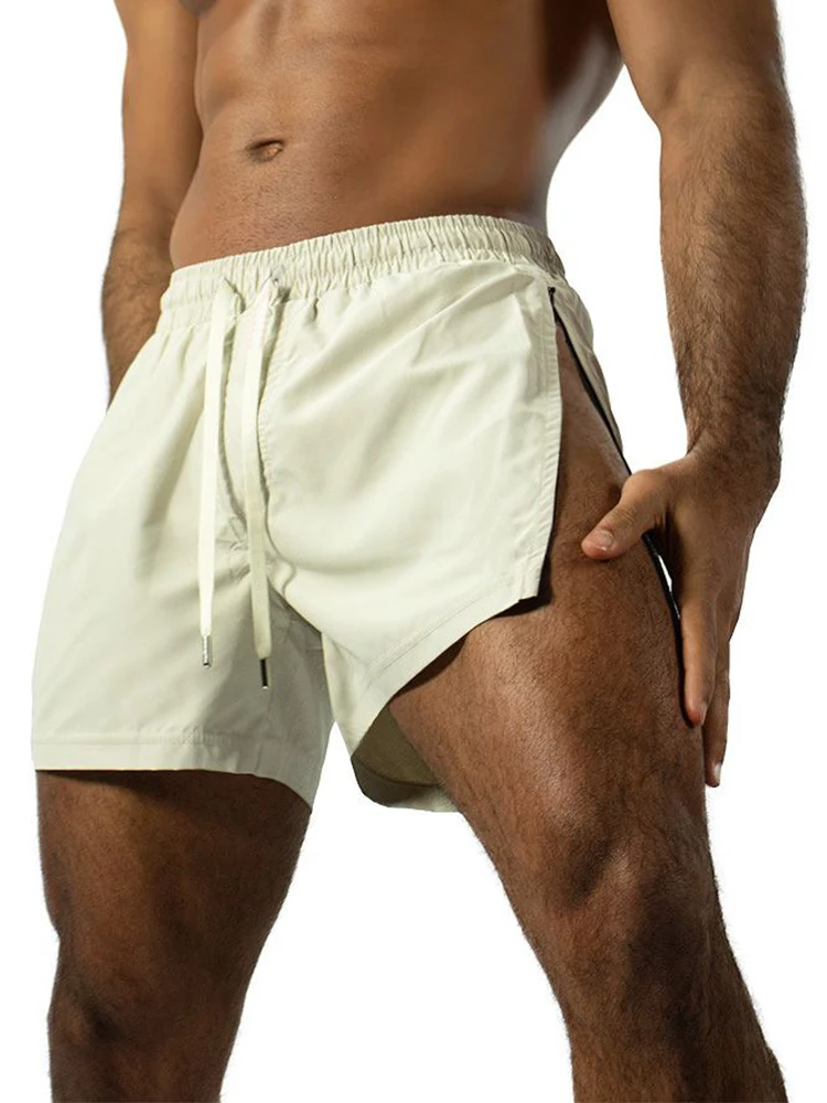 

Сексуальные шорты на молнии с боковым разрезом, мужские спортивные шорты для фитнеса, тонкие быстросохнущие шорты из ледяного шелка на шнуровке, летние повседневные мужские однотонные шорты