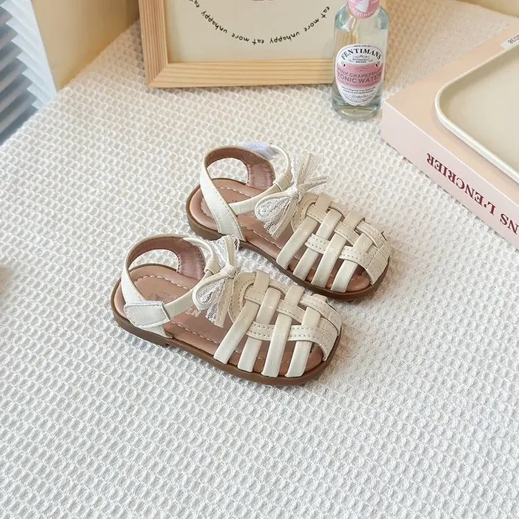 

Детские плетеные римские сандалии, новинка лета 2024, сандалии принцессы с кружевным бантом для девочек, детская повседневная пляжная обувь на мягкой подошве