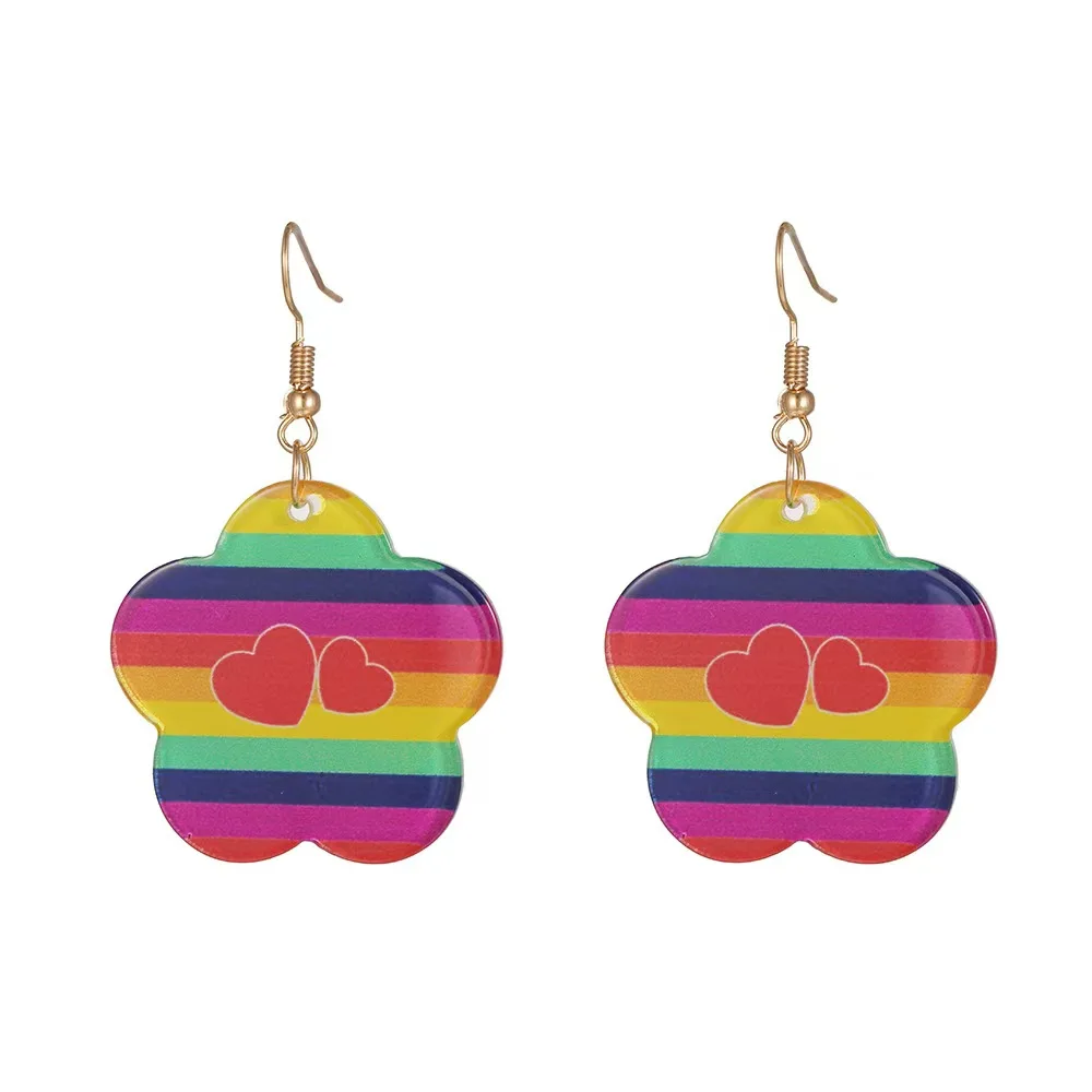 Vibrant Powder Party-Zubehörset: Rosa Brillen, Regenbogenohrringe, falsche Wimpern und ein fuchsiafarbenes Tutu sind perfekt für Pride.