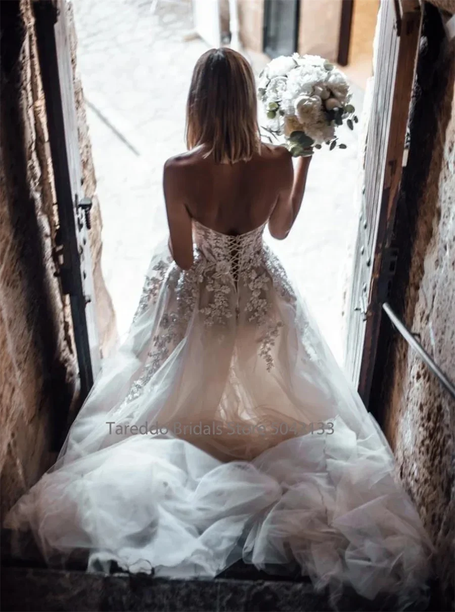 Customized Breathtaking Strapless Wedding Dress Featuring Stunning Crystals Lace Appliques and Flowy Silhouette Bridal Dress