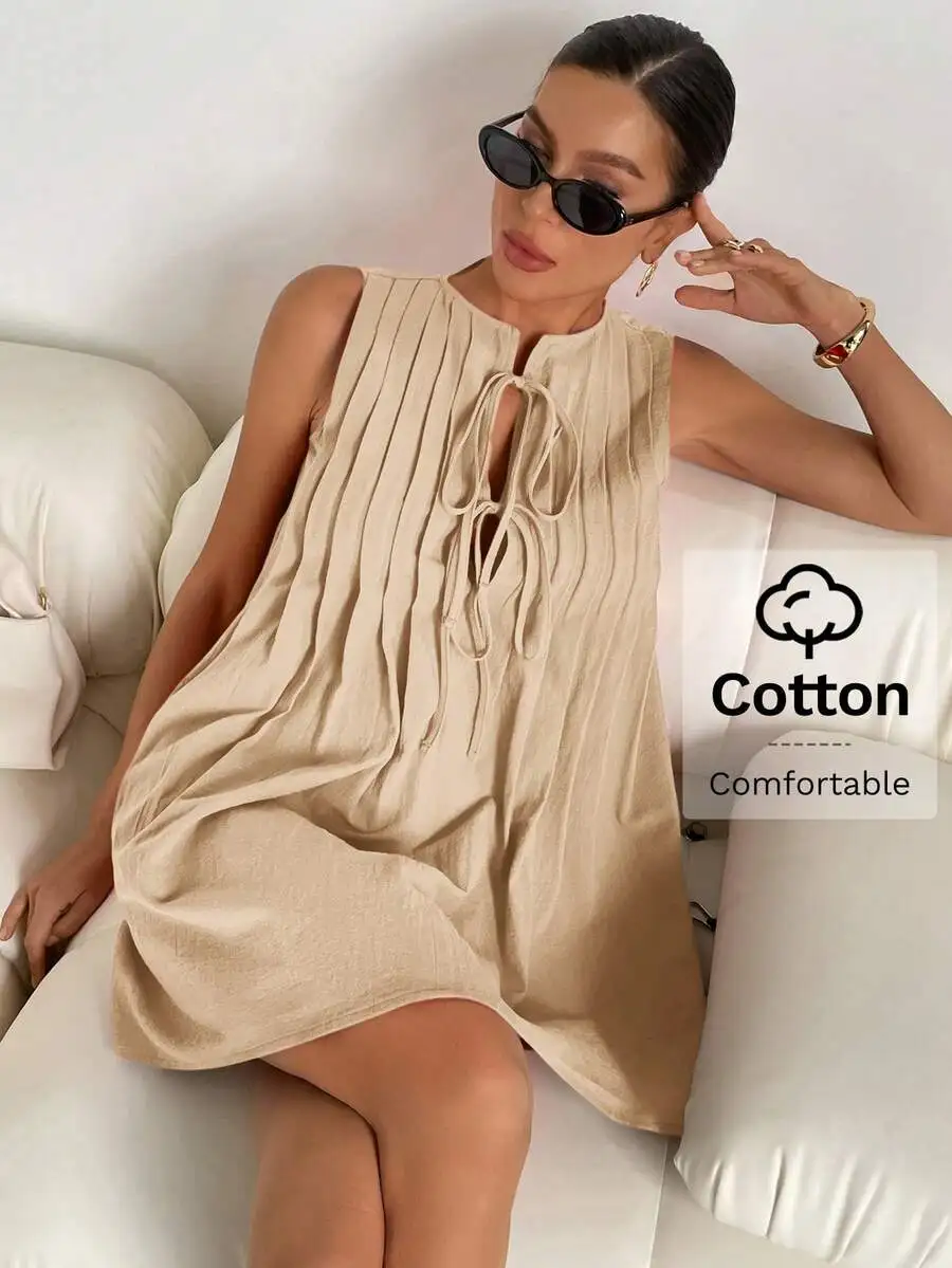 

Бежевое хлопковое плиссированное мини-платье без рукавов с завязками на горловине