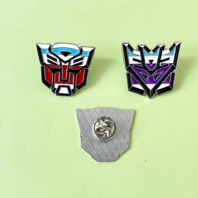 Hasbro Transformers Lapel Pins การ์ตูนตัวอักษรเคลือบ Pin น่ารักเข็มกลัดโลหะ Lapel ป้ายการ์ตูนตลกเครื่องประดับของขวัญ
