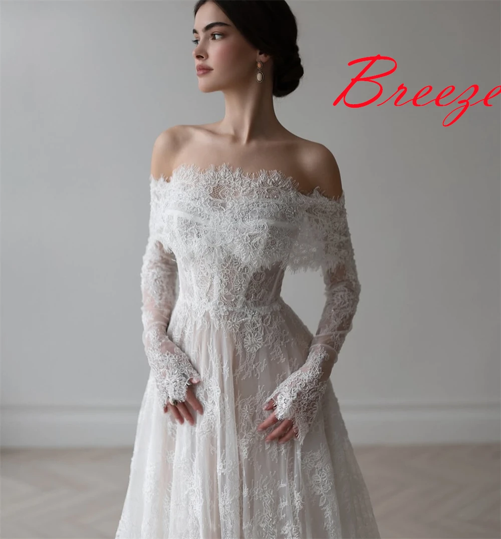 Op maat gemaakte witte organza trouwjurk van hoge kwaliteit, prachtige boothals, lange mouwen, kapelsleep, kanten rugloze bruidsjurken