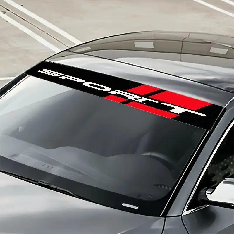 

A single dynamic bold "SPORT" design sticker attached to the front windshield of a car, displaying a striking white capital font