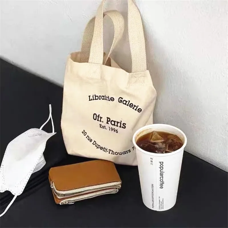 Mini bolso de mano de estilo coreano para mujer, bolsa de compras para Boutique de lona con estampado de letras, bolsa de almuerzo para mujer