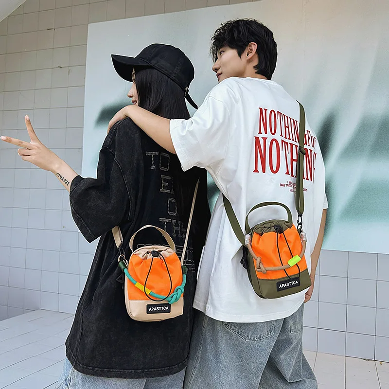 

Waterproof nylon fabric men's single-shoulder bag, sports hand-held crossbody bag, color-matched drawstring drawstring backpack