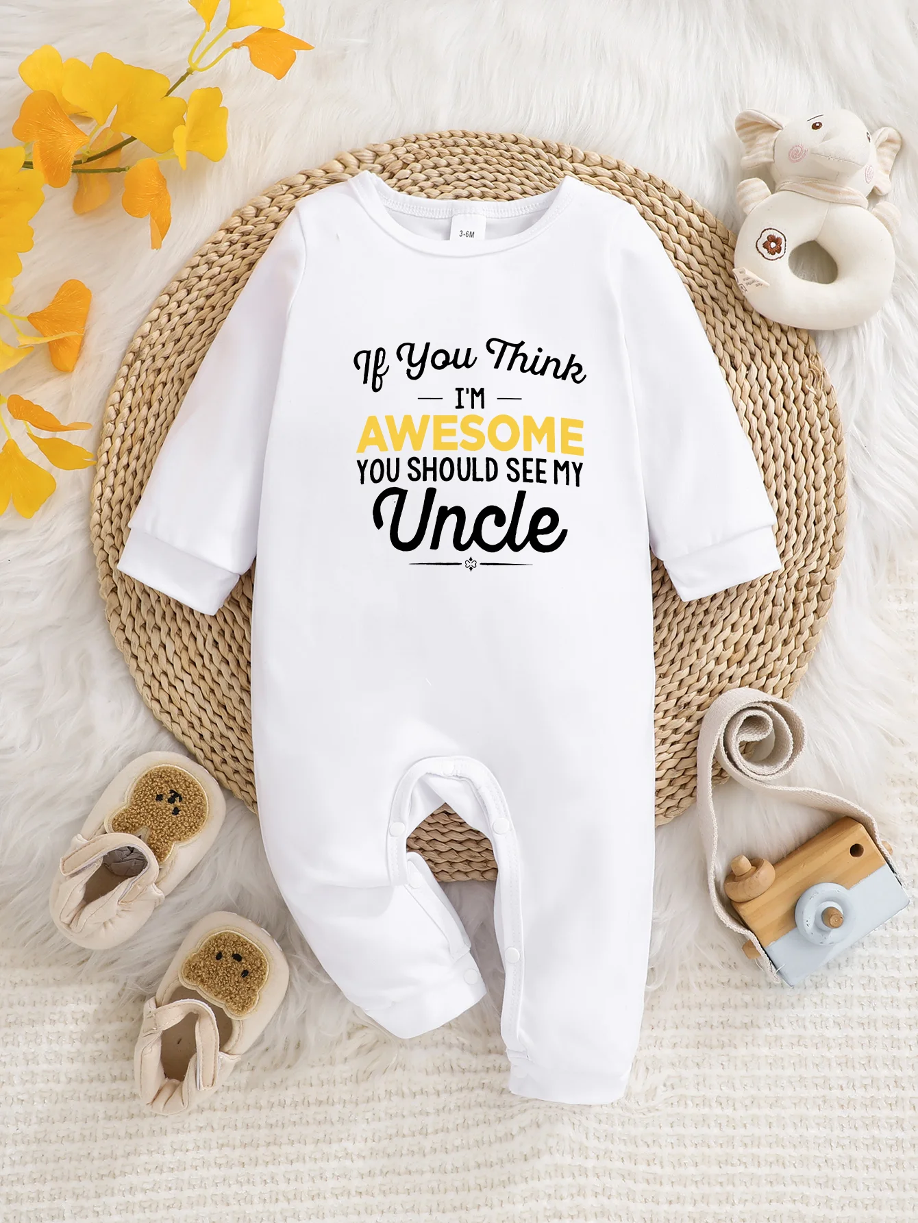 This baby long-sleeve onesie features playful prints and button closure. It is washable, easy to maintain and a practical must-h