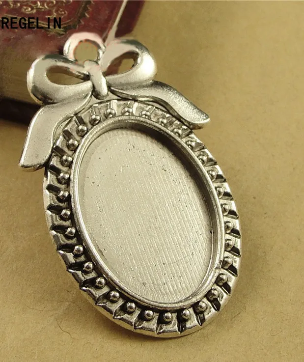 REGELIN 10pcs/lot Two color filigree bowknot cameo cabochon base setting pendant tray 18*25mm Blanks For DIY Jewelry Making