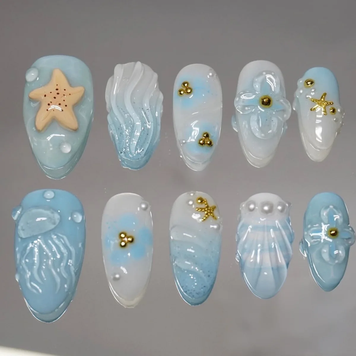 

24PCS Almond Press on Nails Ocean Beach Theme 3D Starfish Jellyfish Wave Design Nails with Gold Bead Pearl Reusable False Nails