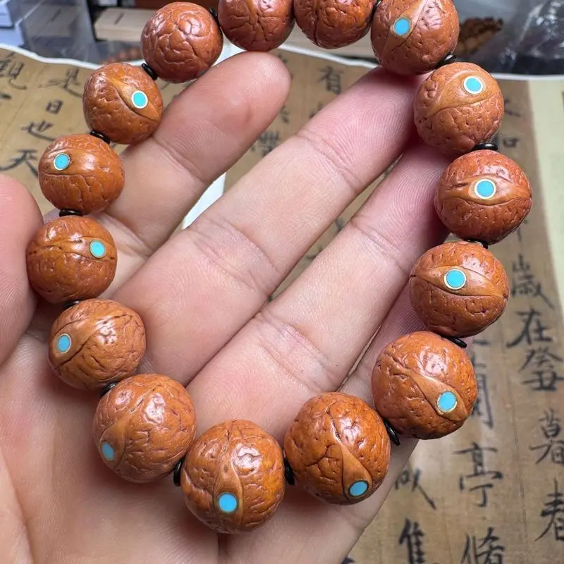 Hand-carved triangular beast design monkey head walnut bracelet, Beijing-style eight-sided peach-shaped bead sing