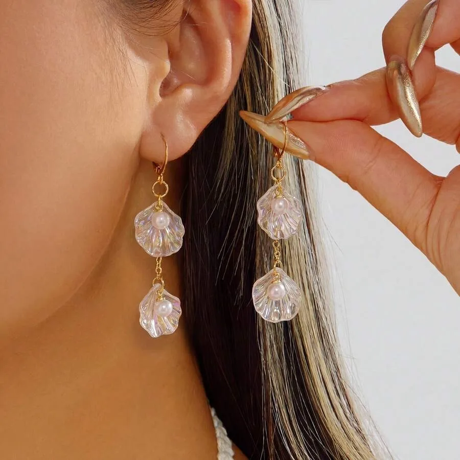 

A Pair Of Luxurious, Sophisticated, Resort-Style Tassel Shell Earrings For Women.