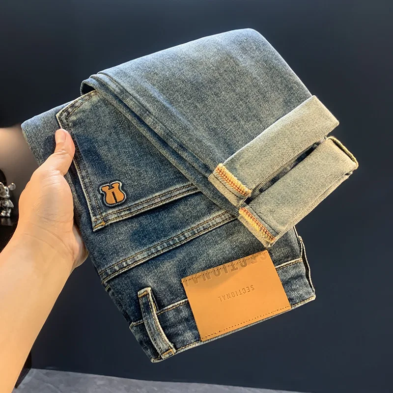 

2025 new retro washed blue tapered jeans for men's autumn trend, versatile and casual slim fit small leg pants