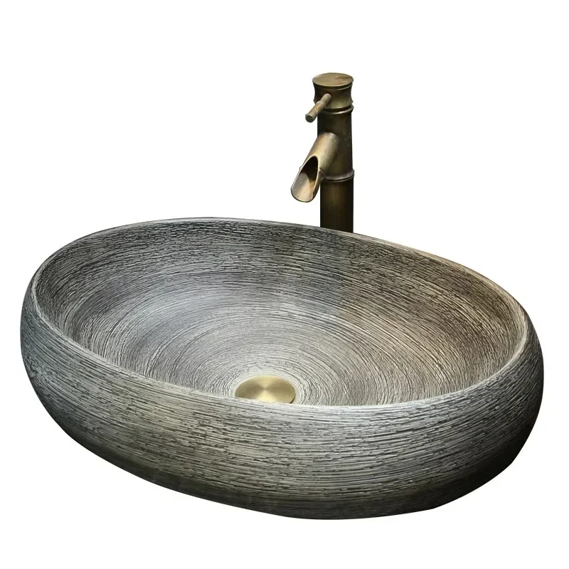 

Antique carved basin on the table, imitation stone ceramic washbasin, minimalist washbasin, oval, new Chinese style