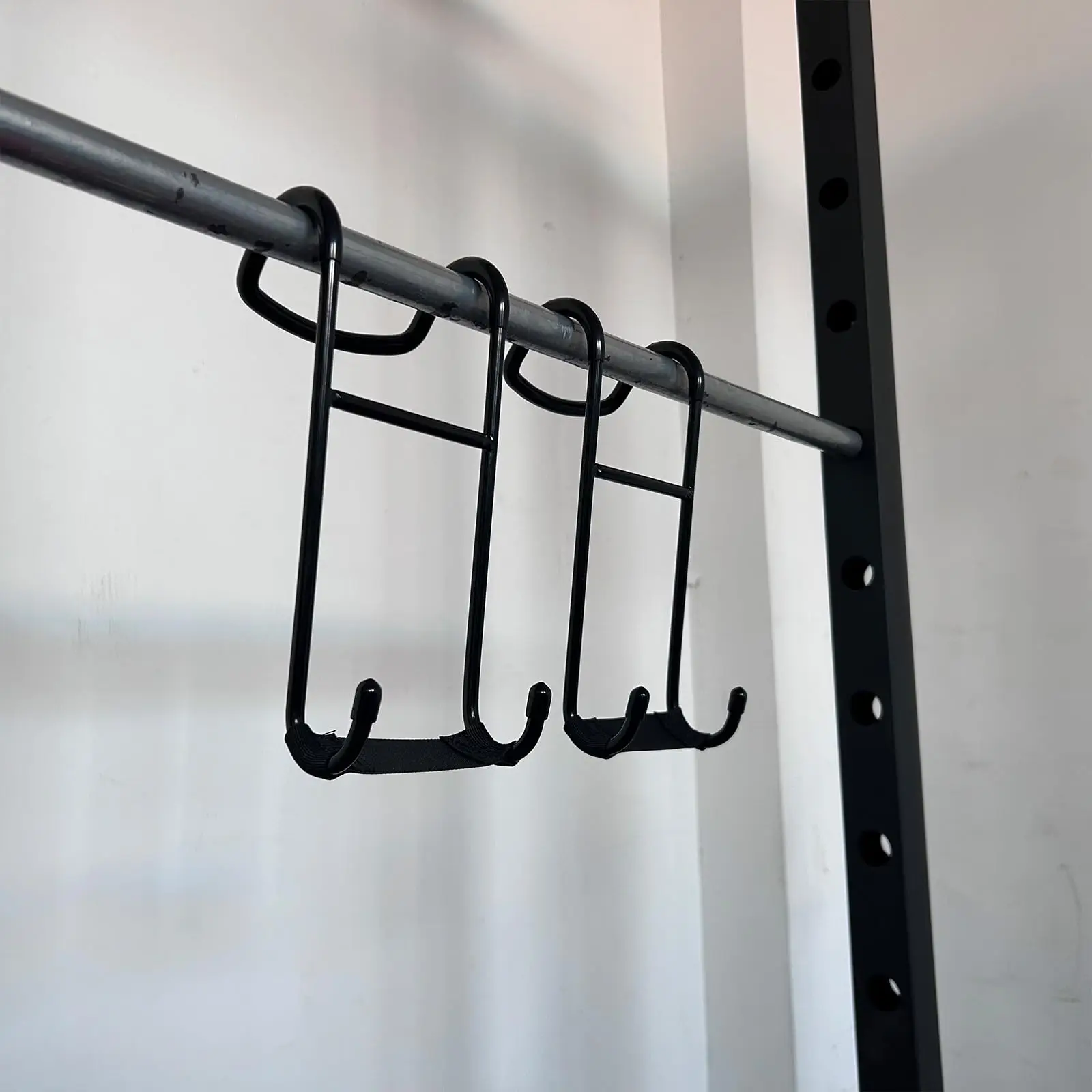A pair of Dumbbell Spotter Hooks,Heavy Duty Steel Dumbbell Hooks Safety Connector for Barbell Bench Press Workout