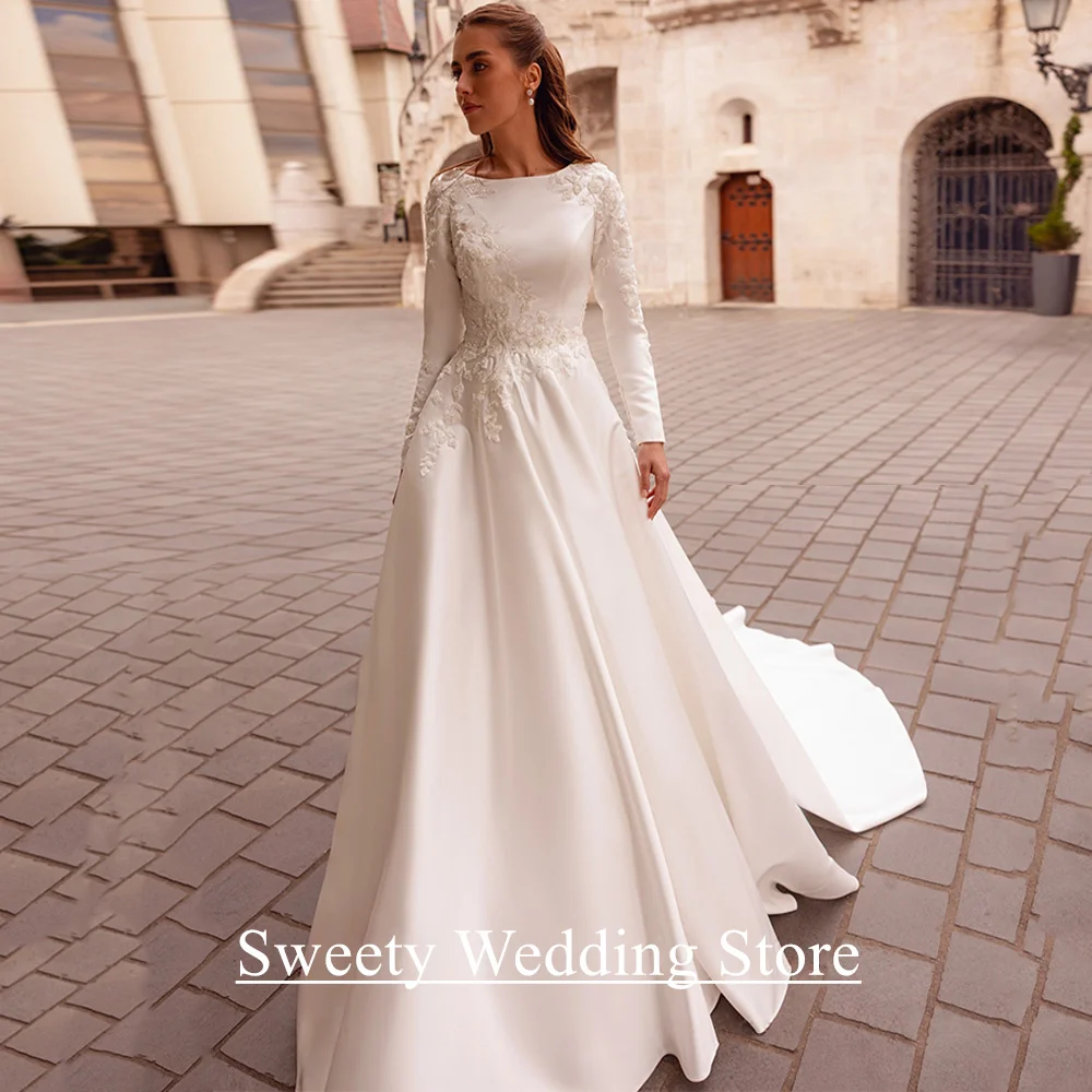Bescheidenes Hochzeitskleid für die Braut, maßgeschneidertes Brautkleid mit Rundhalsausschnitt, langen Ärmeln, Perlenapplikation, A-Linie, Sweep-Zug