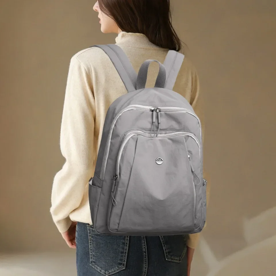 Zaino di alta qualità per donna uomo zaino leggero tinta unita borsa da viaggio per uso quotidiano casual borsa impermeabile multitasche
