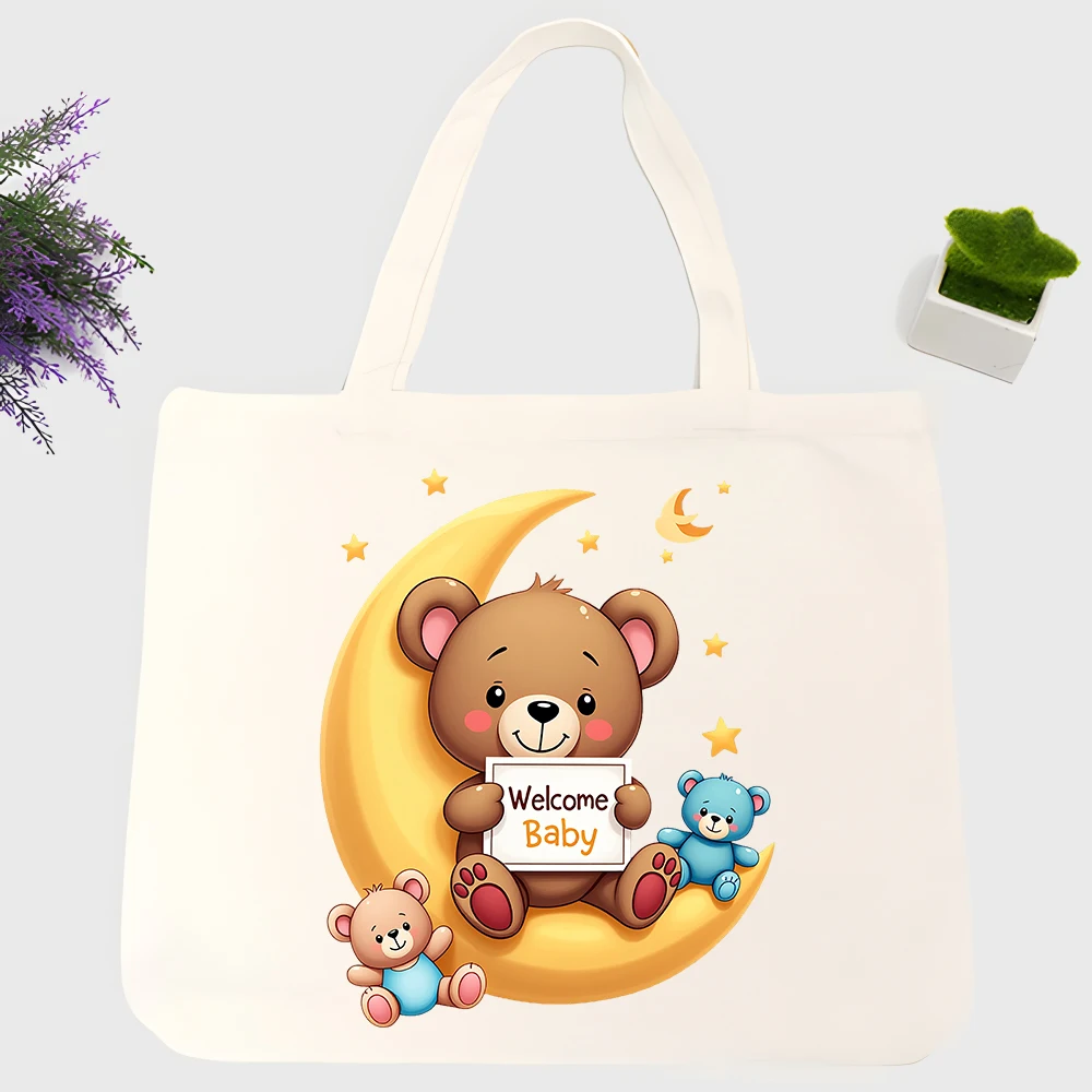 Baby shower canvas tote bag with bear and moon graphic, cute animal design for welcome baby gifting