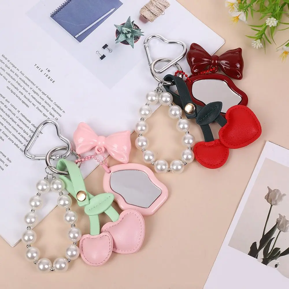 Creative พีชหัวใจเชอร์รี่จี้ Key CHAIN เพิร์ล Bowknot กระเป๋าจี้กระจกขนาดเล็ก PU หนัง Key Ring กระเป๋าสตางค์