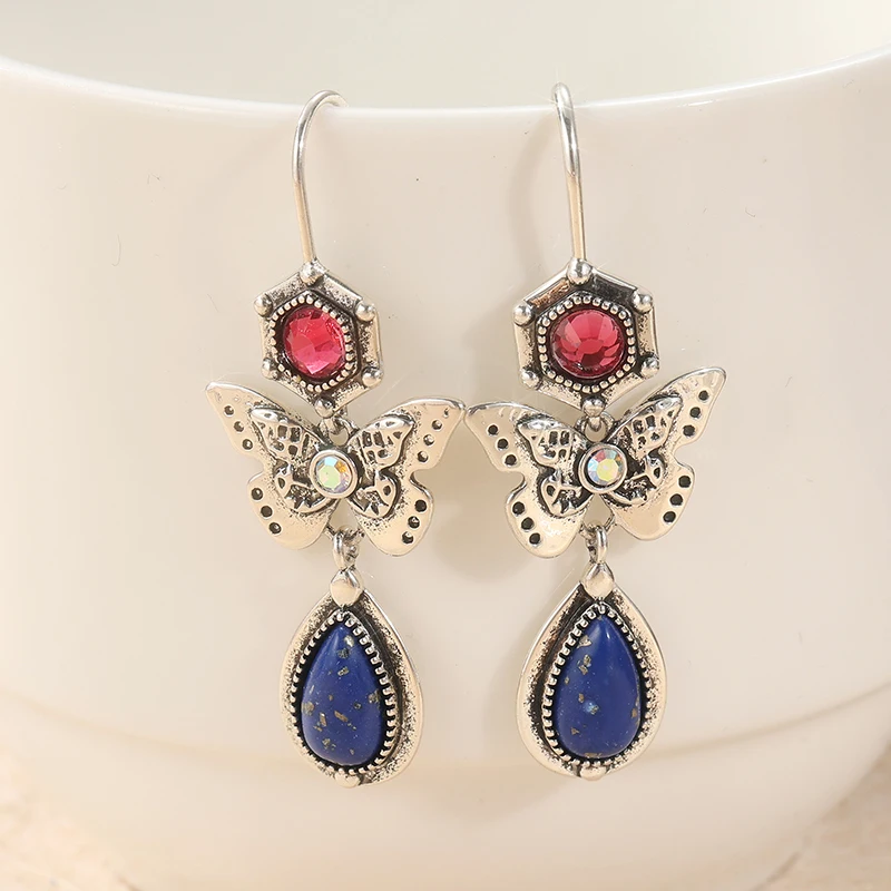 Retro-Punk-Stil Schmetterlingsförmige Anhänger-Ohrringe Einfach Geometrisch Mit Synthetischem Türkis Modeschmuck Ohr-Accessoires