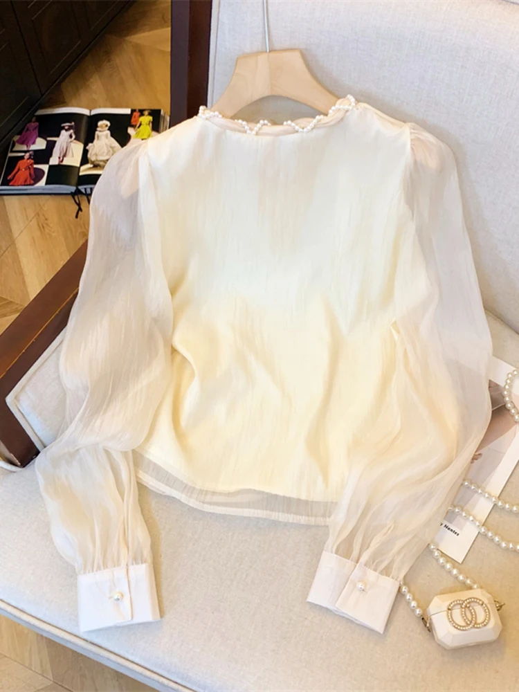 Autumn New Elegant Lady Solid Color Long Sleeved Loose Chiffon Shirt French Fashion Women's Woven Pearl Round Neck Tied Shirt