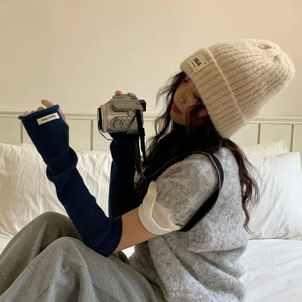 Estilo coreano tejido mangas cálidas Color sólido agujero mangas largas sin dedos dulce elástico guantes de brazo de lana niñas