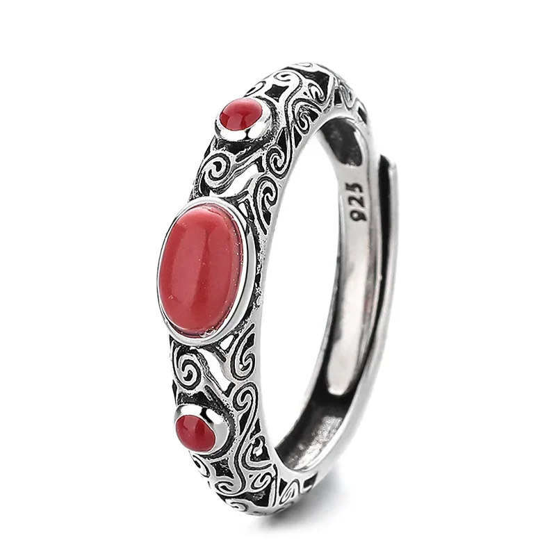 

Creative silver inlaid hollow pattern oval southern red tourmaline cold wind niche design process opening adjustable female ring