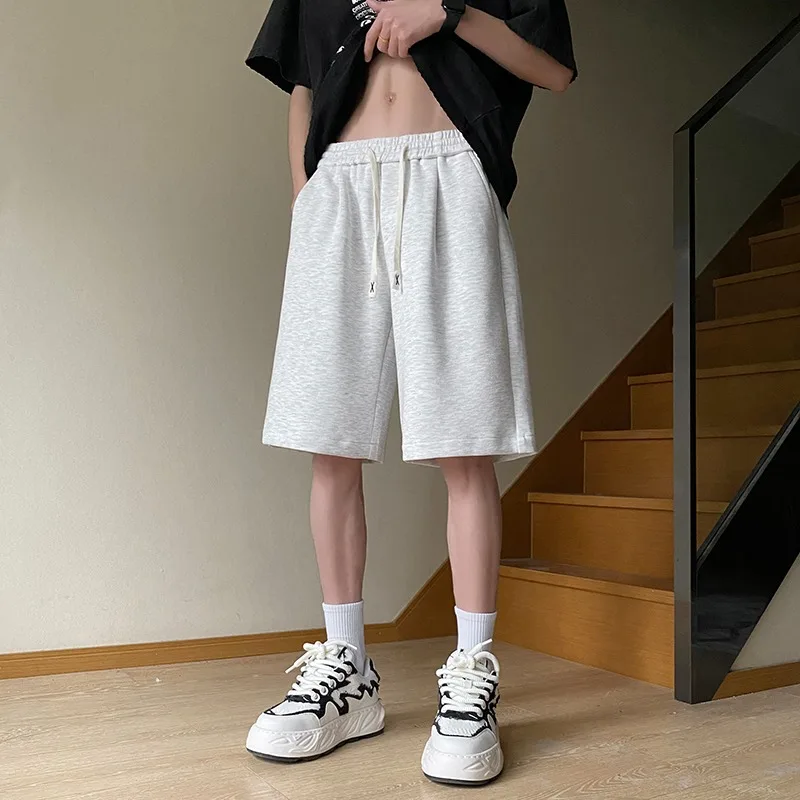 

Летние мужские свободные спортивные брюки большого размера, белые повседневные брюки с цветочным ушком, прямые брюки длиной пять четвертей, молодежные энер...